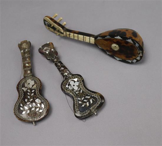 A 19th century Italian miniature mandolin and two similar guitars